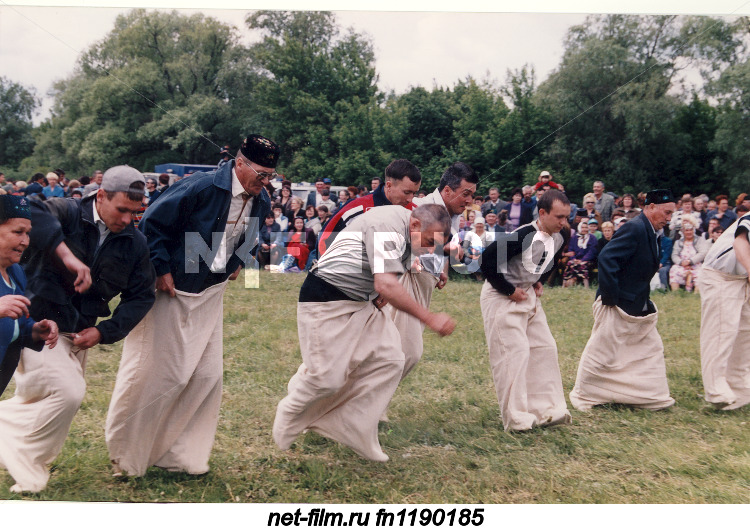 Participants of the contest "Running in bags" during the Tatar national holiday Sabantuy in the