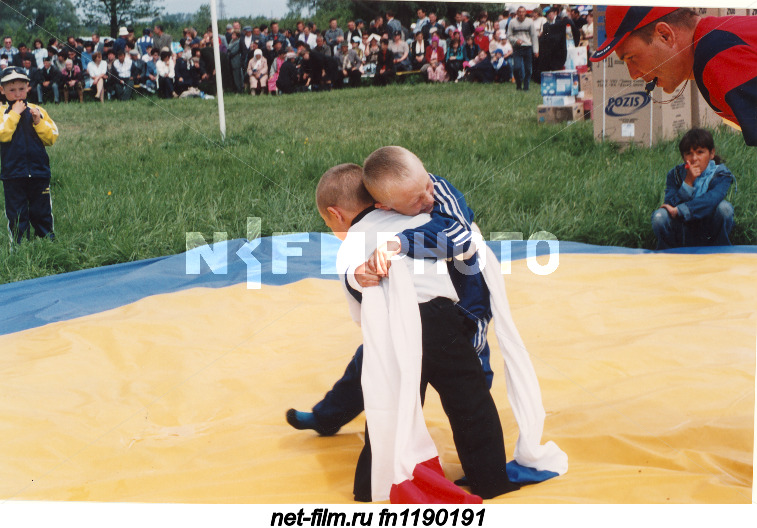 Young participants of competitions in the Tatar national wrestling on belts "kuresh" during the