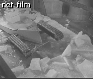 Footage Testing a model of a tracked icebreaker. (1941)