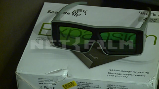 A pack of office paper, special glasses with green lenses