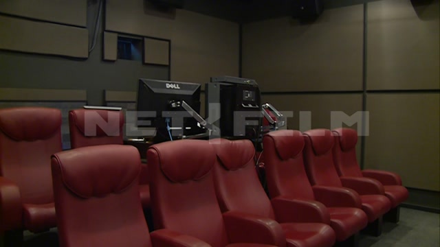 A studio, a small screening room. The frame shows the auditorium seats and a screen