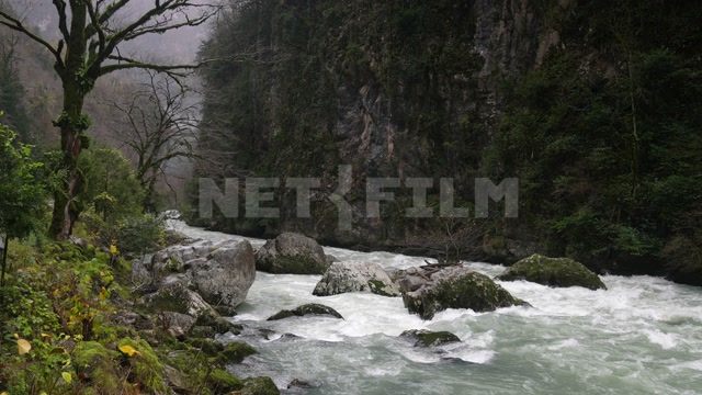 Абхазия, осень, день. Горы. Горная река, камни, течение