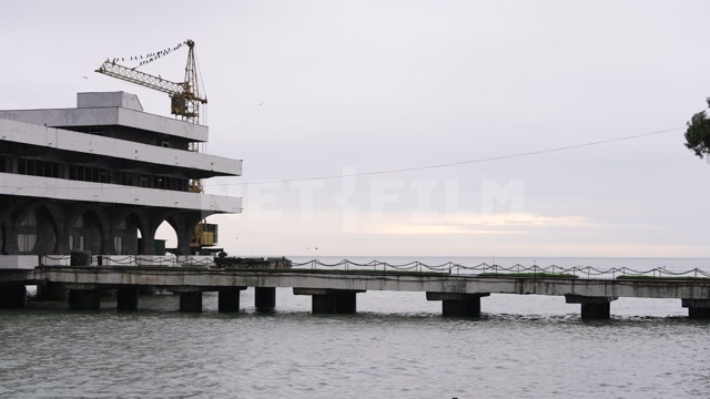 Абхазия, осень, вечер. Сухумский морской порт. Черное море, пристань, набережная