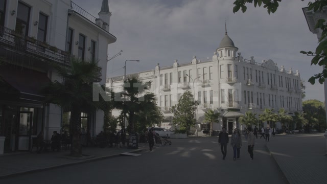 Abkhazia, Sukhum, the Ritsa Hotel building. People are walking the streets