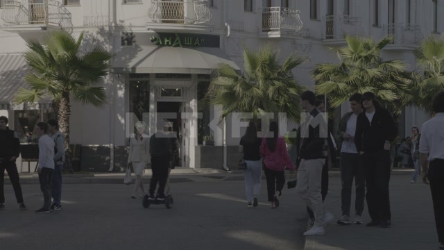 Abkhazia, Sukhum, summer, daytime, the Ritsa Hotel building. Palm trees, promenade. People