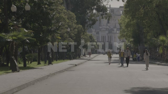 Абхазия, Сухум, лето, день. Променад, гуляют люди