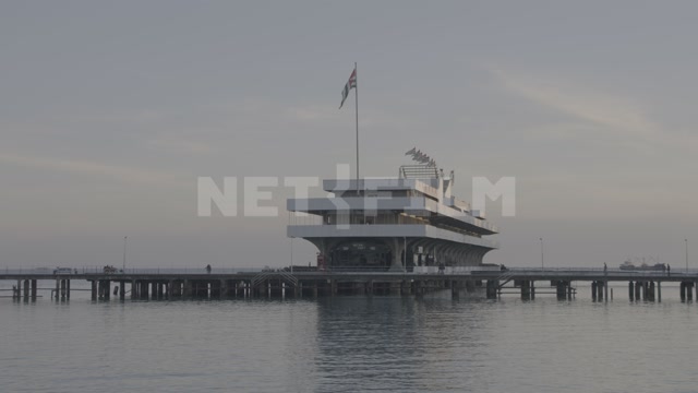 Abkhazia, Sukhumi, evening. Black Sea, embankment. Marine terminal building, pier, dock