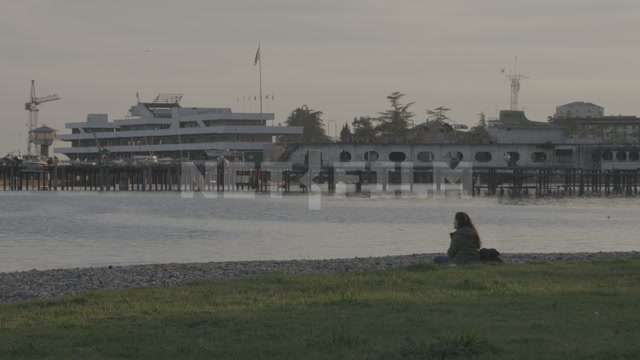 Abkhazia, Sukhumi, evening. Embankment, sea. View of the sea terminal, pier