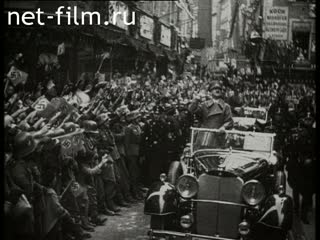 Footage Hitler rides through the streets. (1933-1944)
