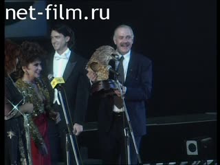 Footage Gina Lollobrigida presents the prize to Nikita Mikhalkov. (1996)